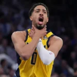 Indiana Pacers star guard Tyrese Haliburton shows the choke sign