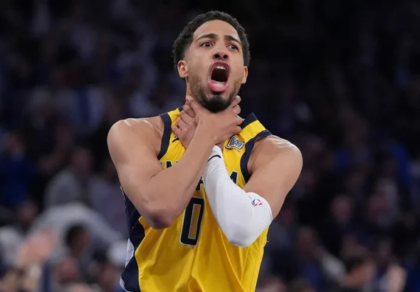 Indiana Pacers star guard Tyrese Haliburton shows the choke sign